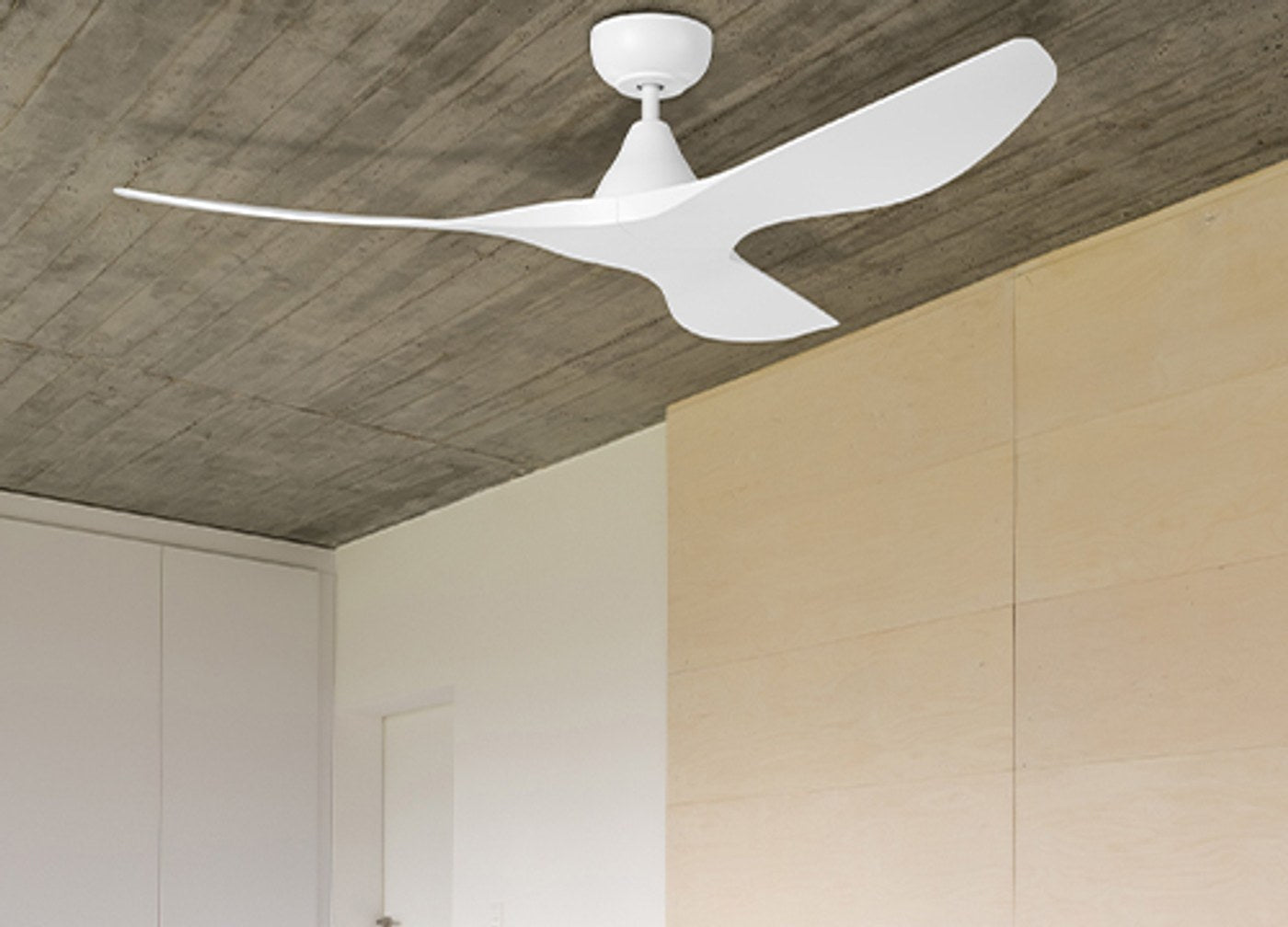 White DC ceiling fan in a modern natural-textured bedroom — AC vs DC vs EC motor guide