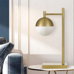Basilo Table Lamp in Antique Gold or Black — lifestyle