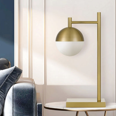Basilo Table Lamp in Antique Gold or Black — lifestyle